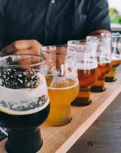 Beer tasting board on table in pub.