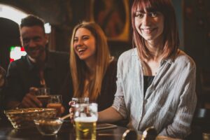 Group of teens having fun in a pub