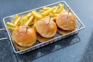 Mini burgers with french fries served at the bar, finger food